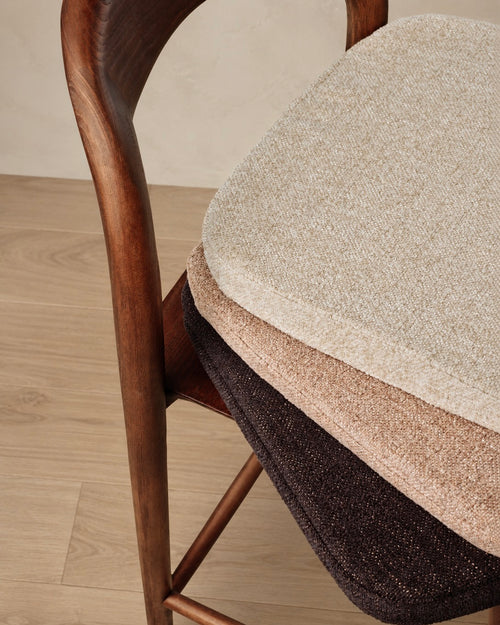 t4option0_0 | Close-up of the Nora bar chair with beige, brown and black seat cushions stacked for colour comparison.
