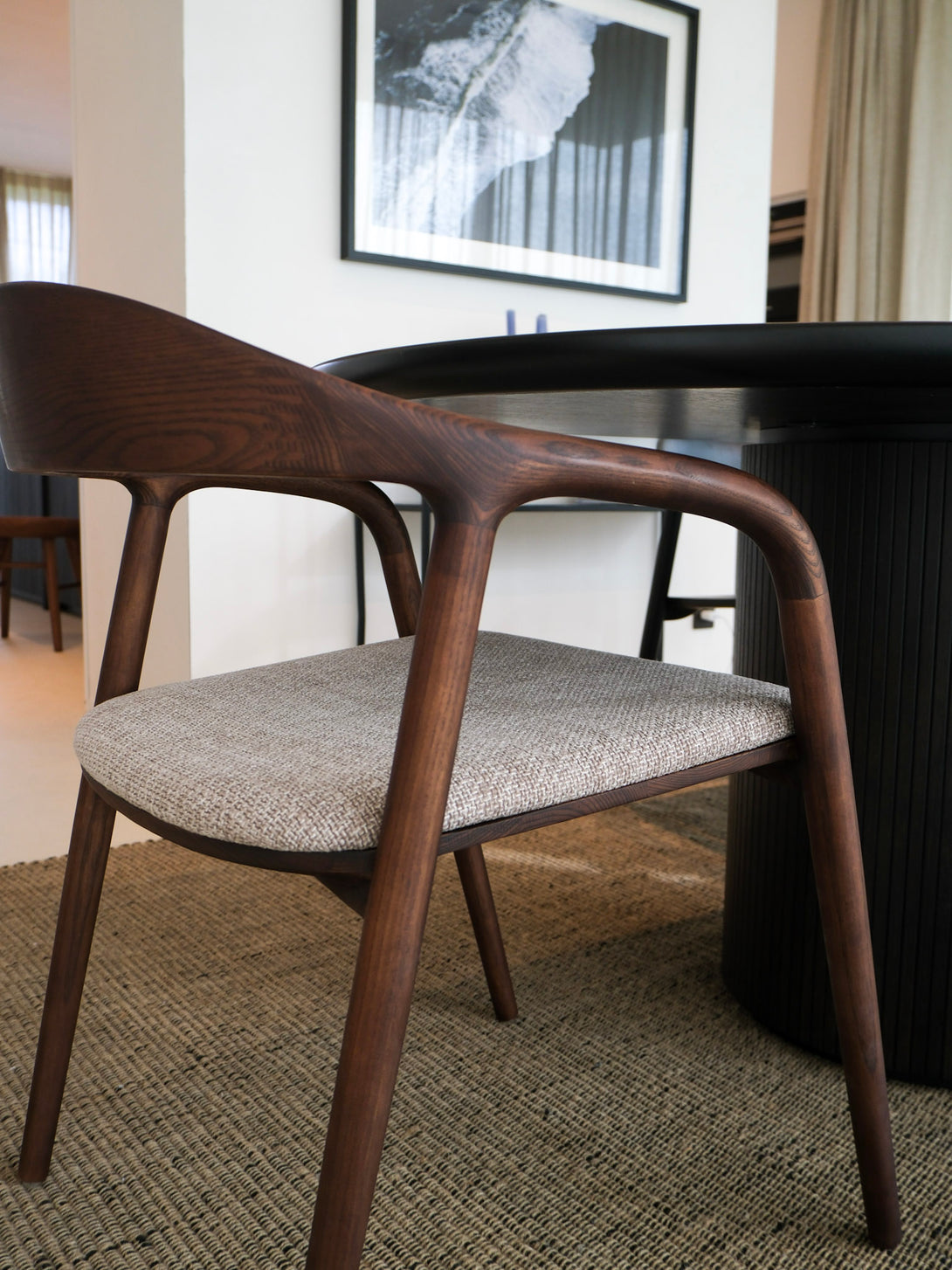 Mowelli's walnut chair with upholstered fabric, FSC-certified and Belgian-based.