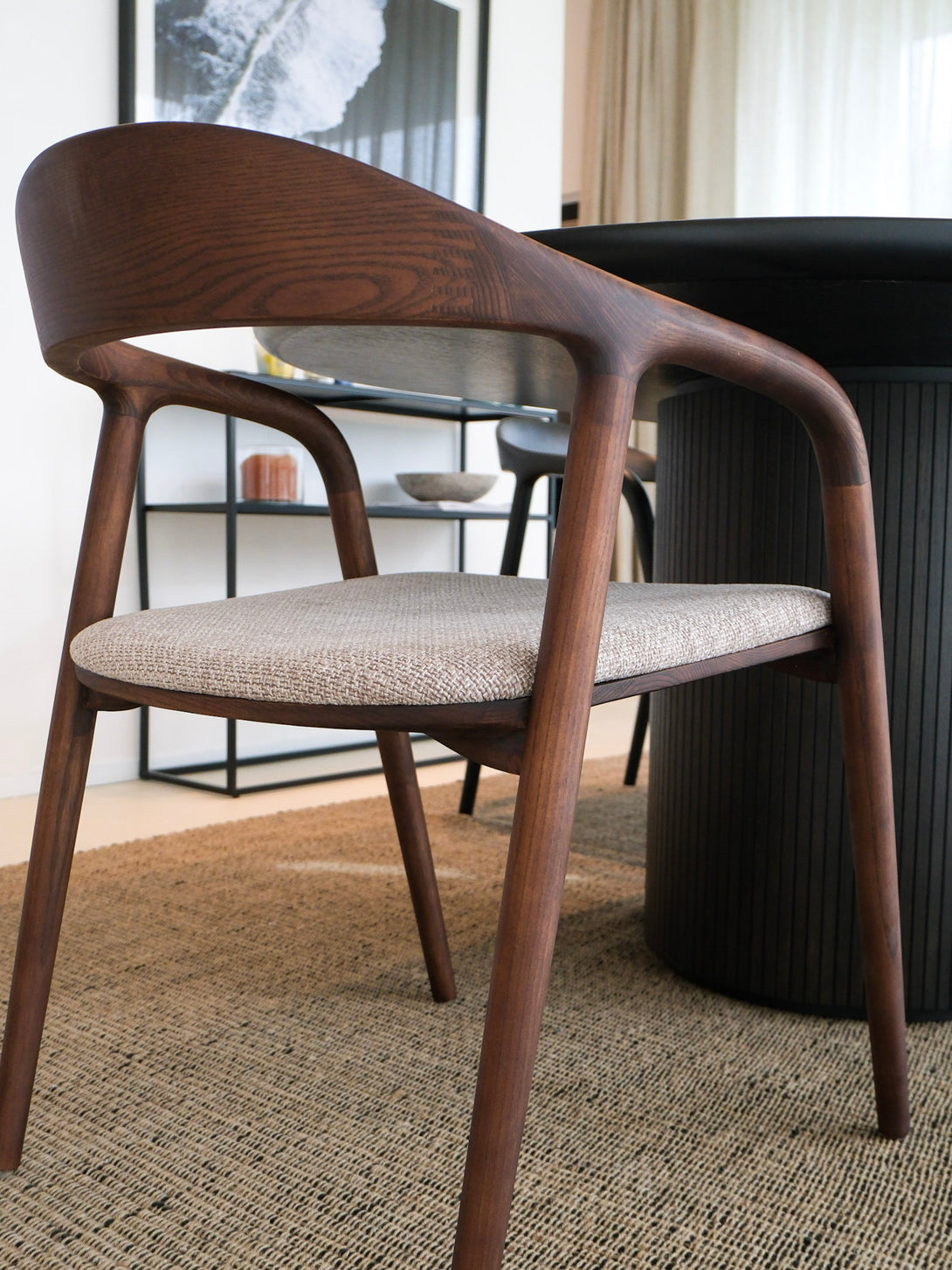 Wooden chair with a cushioned seat in a modern interior setting
