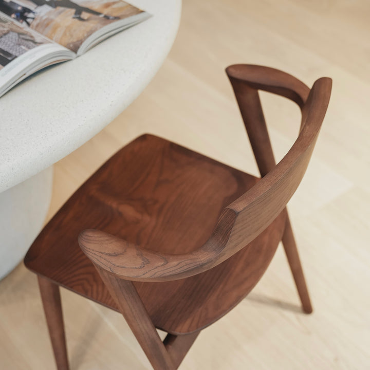 Top view of Jules wooden chair by Mowelli – minimalist Belgian design with smooth curved backrest and solid seat