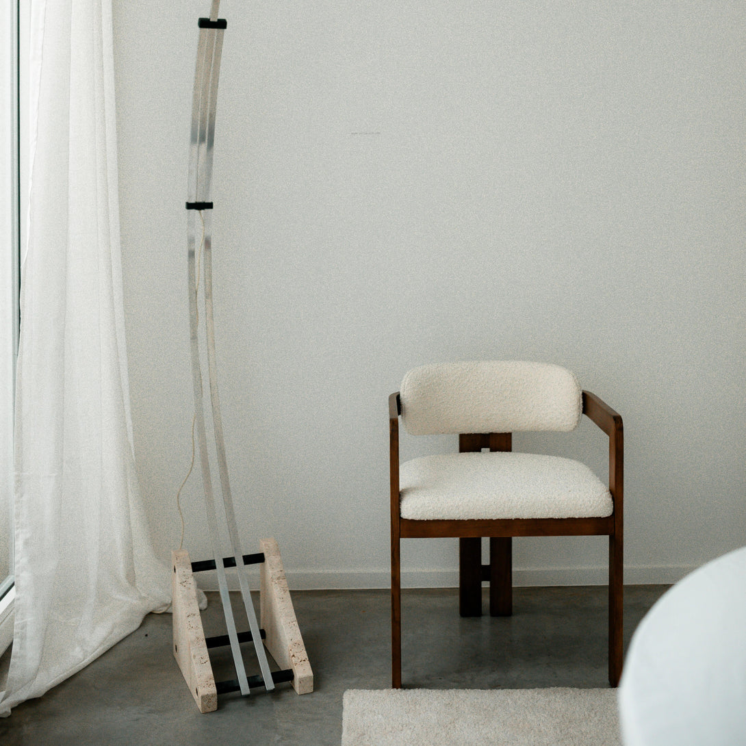 Mila dining chair by Mowelli in walnut wood with soft textured upholstery, a sustainable European design piece.