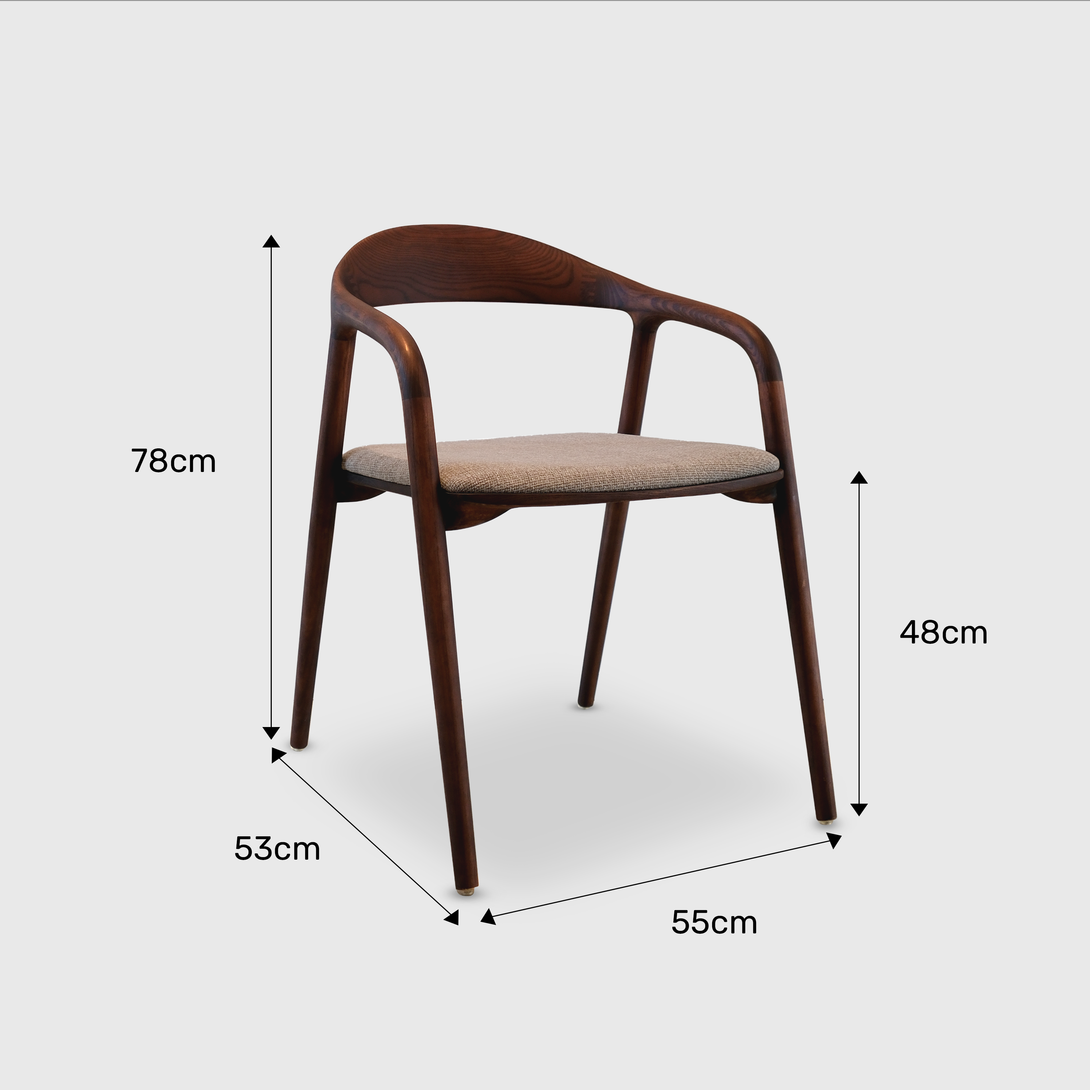Nora chair by Mowelli – stylish wooden chair in brown walnut with soft upholstered cushion seat, perfect for modern interiors.