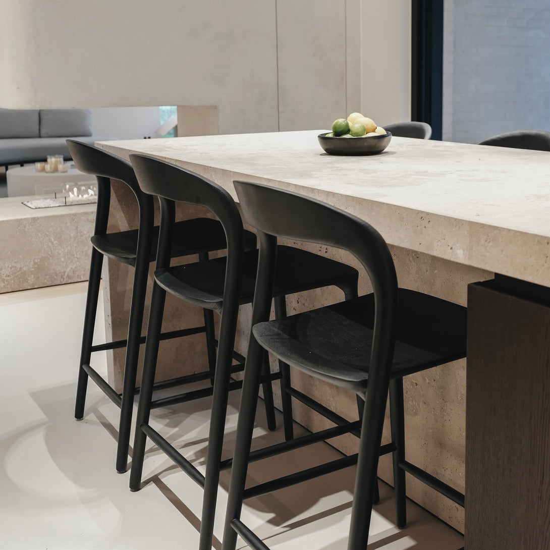 Set of black Nora bar stools by Mowelli – sleek Belgian design for modern kitchens