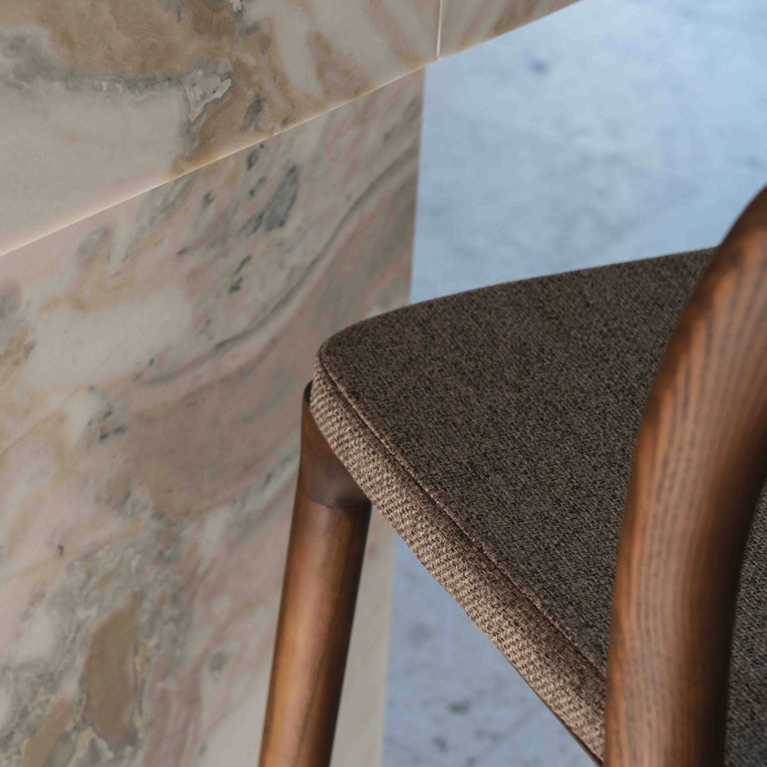 Close-up of a mocha brown cushion on the Nora bar stool by Mowelli