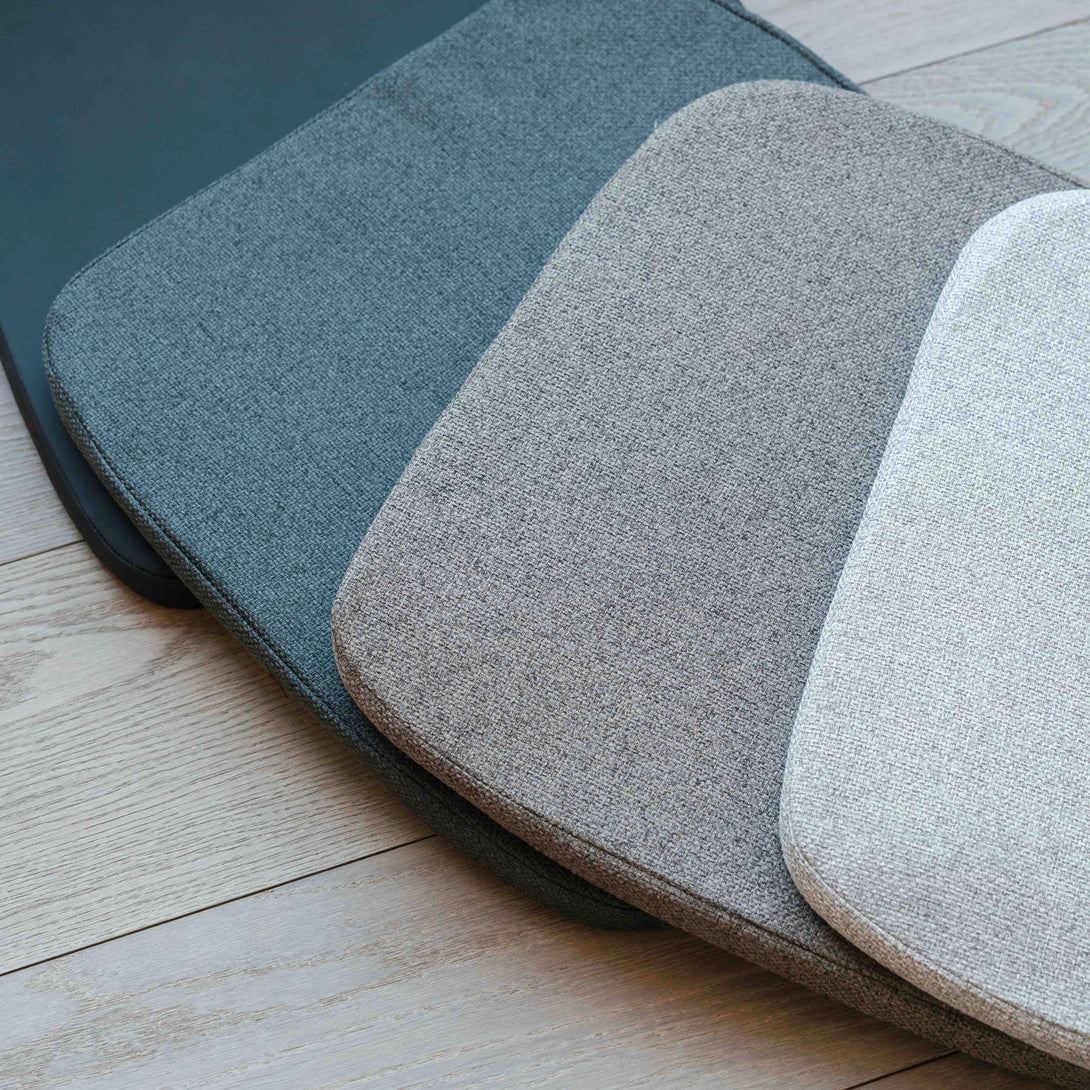 A total view of the four different colours of pillows, presented next to each other to see the differences