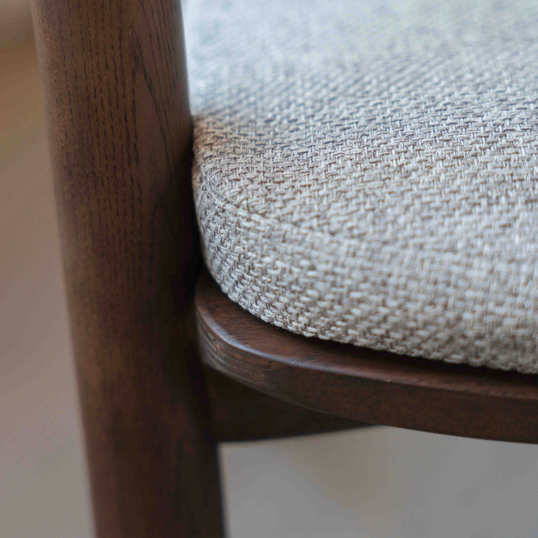 A detailed shot of a soft greige pillow