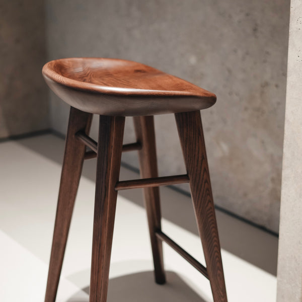 Close-up of Ollie bar stool in dark walnut finish by Mowelli