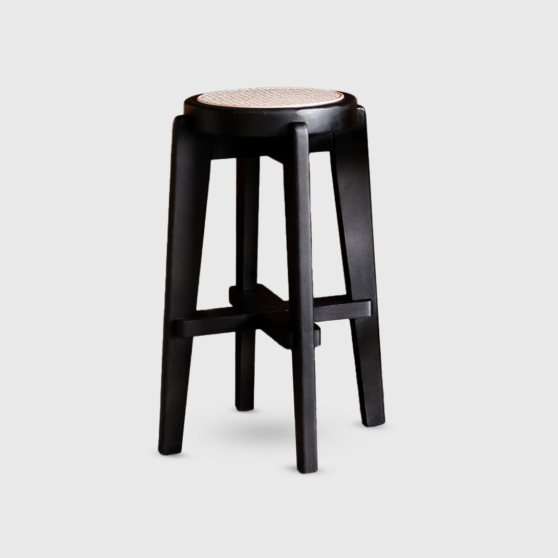 Black Pablo bar stool with rattan seat on a white background