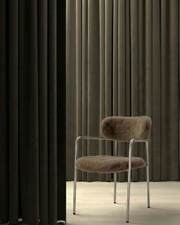 t4option0_1 | Coco dining chair in sage grey upholstered fabric with stainless steel frame in a minimal interior with dark curtains