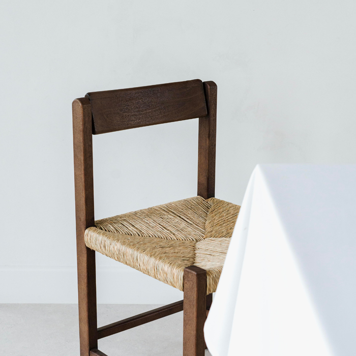 leo dining chair made of solid hevea wood with handwoven rush seat in rubwood brown