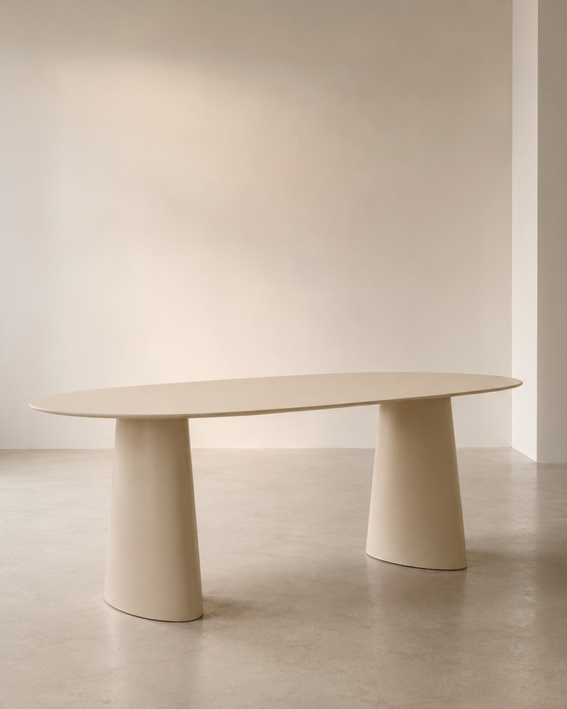 t4option0_0 | Mowelli Lago oval dining table in soft cream with twin conical pedestal base, studio shot