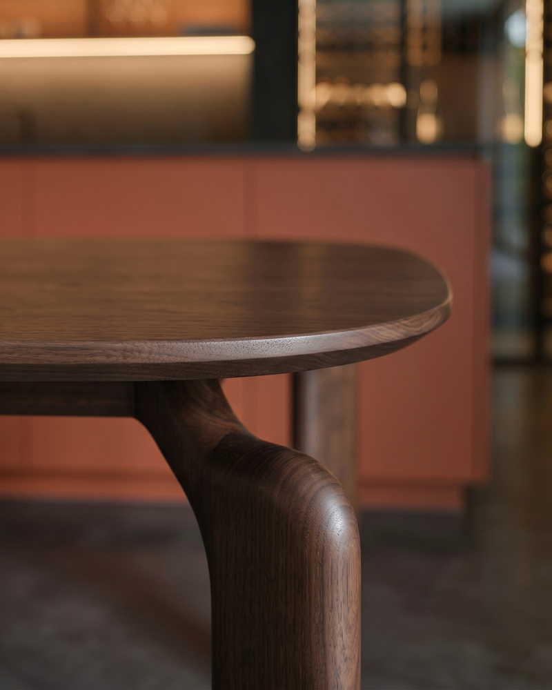 close up mowelli arco dining table in walnut , zoom in on arch