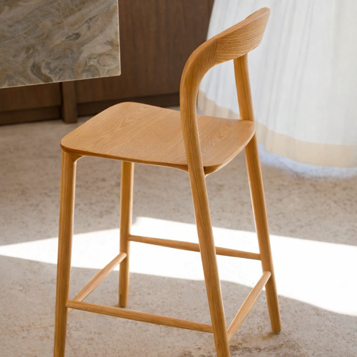 Solid oak Nora bar stool in a modern interior.