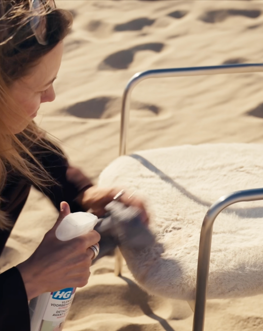 Testing the Coco dining chair's easy-clean upholstery.